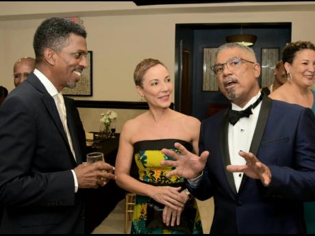 Minister of Foreign Affairs and Foreign Trade Senator Kamina Johnson Smith (centre) shares in light conversation with Michael McMorris (right),  president of the Jamaica Chamber of Commerce (JCC),  and  Ian Neita, immediate past president, JCC.