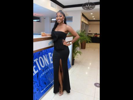 Sable-Joy McLaren, marketing manager, FirstRock Group, effortlessly embodies style as she strikes a pose on the grounds of The Jamaica Pegasus at the Jamaica Chamber of Commerce Annual Awards Ceremony. 