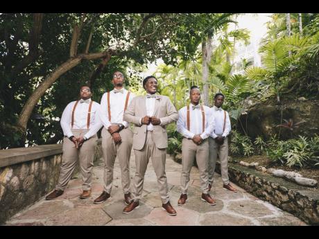 With his smile being his super power, the groom celebrates the day he became a husband alongside his groomsmen (from left) Devonte Hooper, Raheem Blackwood (best man) Clayon Clark and Brandon Bailey.
 
