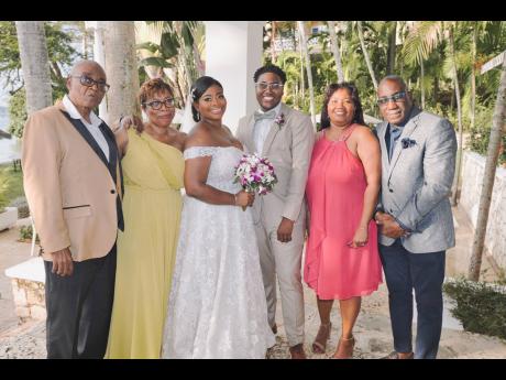 It meant the world to the newly-weds to receive blessings from their parents. From left: parents of the of the bride, Patrick and Andrea Boodie; the bride and groom; and the parents of the groom, Fiona Johnson and Ruddi Stevens.