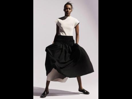 With Paul Helbers as the creative director and Mel Bless as the photographer for Fforme’s new spring-summer collection lookbook shoot, Kai Newman rocks a sculpted cap-sleeve dress, layered with a tuck pleat skirt.