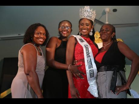 Miss Clarendon Festival Queen Shanecia Daley is congratulated by (from left) her friend Christine Russell-Lewin; sister, Shaniqua Daley; and mother, Sophia Daley.