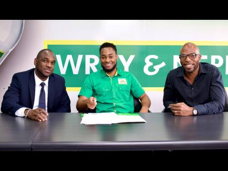 It was a meeting of heavyweights as Jamaica Boxing Board directors David Clarke (left) and Stephen Jones (right) joined J. Wray & Nephew’s Marketing Manager Pavel Smith to sign off on a sponsorship deal to stage an eight-month boxing series for amateur a