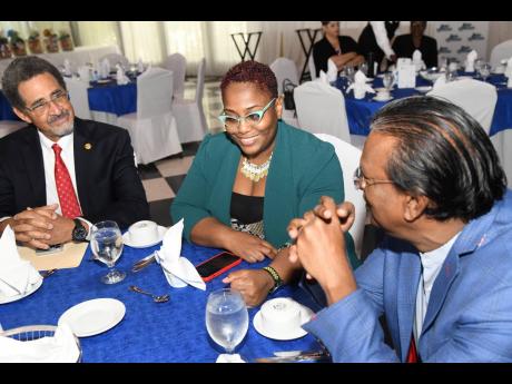 From left: President and CEO of Sterling Asset Management, Charles Ross; Strategy, Progamming and Innovation Lead Officer at the Inter-American Development Bank, Terry-Ann Segree; and partner at PwC Jamaica, Wilfred Baghaloo, in discussion at the PSOJ Pres