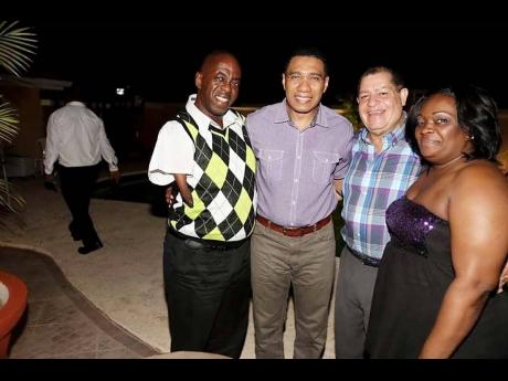 From left:  Lennox Powell with Prime Minister Andrew Holness, Member of Parliament for Northeast Manchester Audley Shaw and his wife Sonia Powell at a function in the parish some years ago.