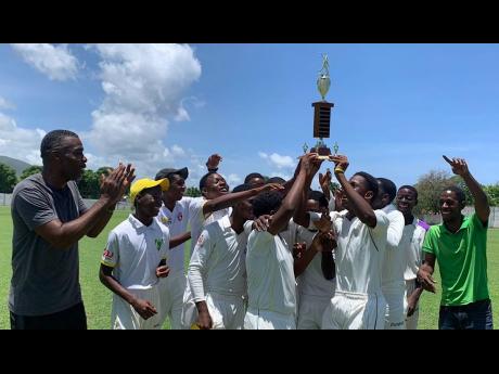 Excelsior High School’s players and coaches celebrate after securing the ISSA Under-16 urban area title at Kensington Park on Tuesday.