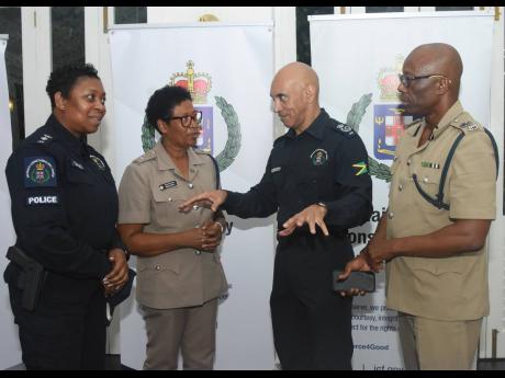 Major General Antony Anderson (second right), commissioner of police, in conversation with  Senior Superintendent Stephanie Lindsay (left), head of the Constabulary’s Communications Unit; Superintendent Sharon Beeput, commanding officer for Hanover; and 