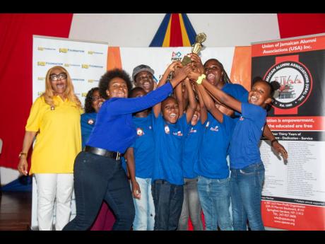 Students from Beulah All-Age & Infant School in Clarendon celebrate their victory against eight other primary and preparatory schools at the FIRST Lego League piloted by FIRST Tech Challenge Jamaica recently at The University of the West Indies, Mona. The 