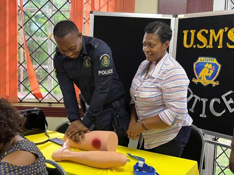 Members of the Westmoreland police learn bleeding control techniques during a STOP The Bleed training session conducted by personnel from the Department of Nursing at Northern Caribbean University at the regional campus in Montego Bay on May 24.