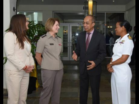 Deputy Prime Minister Dr Horace Chang (second right) in discussion with (from left) Amy Tachco, chargé d’ affaires, US Embassy; General Laura Richardson, commander, US Southern Military Command; and Rear Admiral Antonette Wemyss Gorman, chief of defence