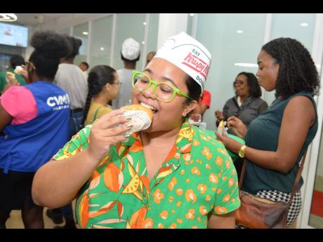 Culinary content creator, Tiana ‘Wonga Gyal’ Chung, sinks her teeth into an original glazed doughnut, hot and fresh from the oven. 