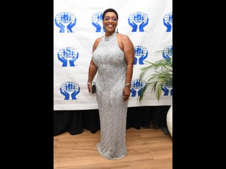 Joydene Jarrett, general manager of the JPS and Partners Co-operative Credit Union, in a silver sequinned gown.