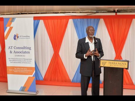 Dr Ashwell E. Thomas adresses the audience at the launch of his book ‘Planning for Tomorrow’.