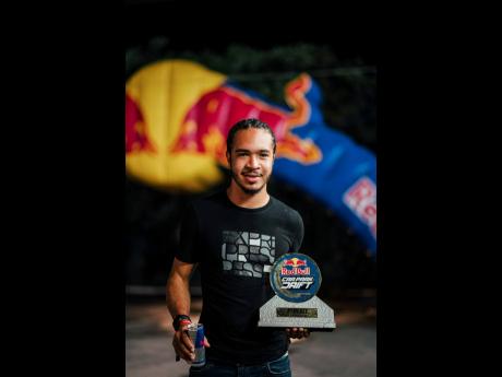 Last year’s winner Nicholas Barnes poses for a photograph at the Red Bull Car Park Drift in Montego Bay, Jamaica on October 1, 2022. 