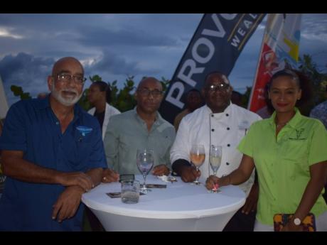 From left: Wayne Lobban, owner, Water Hub, makes a point to Everett Watson, chief financial officer, Jamaica Inn and Tamara Cox, business development officer, Arosa Jamaica.