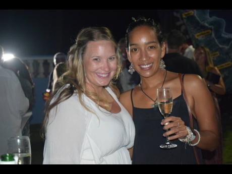 Debbie Shim (left) and Charity Zalk are all chic during cocktails for the sixth Annual Jamaica Inn Backgammon Tournament. Zalk supported Shim, a first-time participant at the event for which proceeds will go towards the White River Fish Sanctuary.