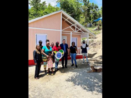 From left: Ann Bishop from Housing Foundation of America, house recipient Gey Sharie Passly; Courtney Gardener, supervisor of the construction team; Marsha Rose, marketing manager Food For the Poor; Consul General Oliver Mair; Kivette Silvera, executive wi