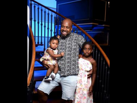 Mark Telfer enjoying quality time with his daughters, Mazhira (left) and Mayuri.