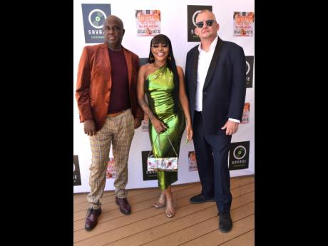 From left: Supreme Promotion’s Isaiah Laing, musical director of Savage Entertainment; Savage Entertainment CEO Michael Midkiff and dancehall artiste Suspense.