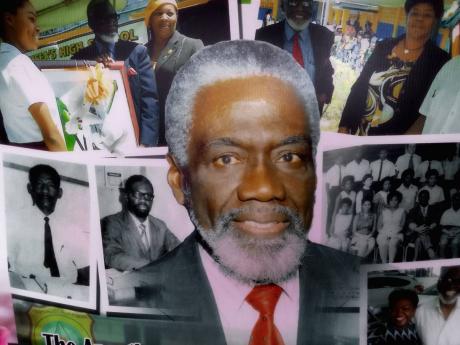 A photo collage involving the first principal of the Green Island High School, Dr Simon Clarke, that was on display at the candlelight vigil held at the school.