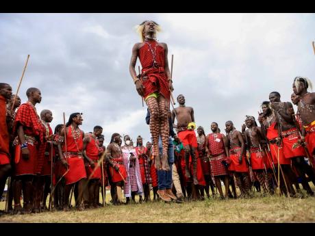 
Maasai morans (warriors) perform traditional jumping as Kenya’s Maasai community held an inaugural Maasai Cultural Festival, on the outskirts of Maasai Mara National Reserve, Kenya’s Rift Valley.