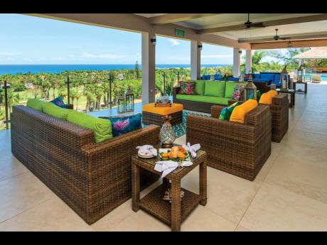 The  outdoor deck watching over golf course and sea.