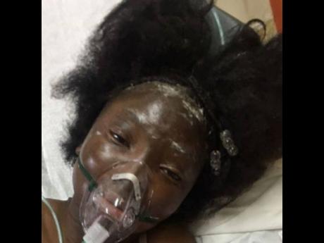 Fourteen-year-old Ackalia Dunkley, who was severely burnt from a gas stove explosion at her home in Burnt Savanna, St Elizabeth on Friday, receiving medical treatment at hospital