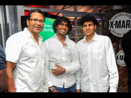 From left: Richard Pandohie, chief executive officer of Seprod Group, celebrates the occasion with his sons Nathaniel and Sebastian.