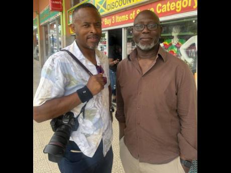 Darren Lewis (right), assistant editor at the United Kingdom’s Daily Mirror, and photojournalist Humphrey Nemal.