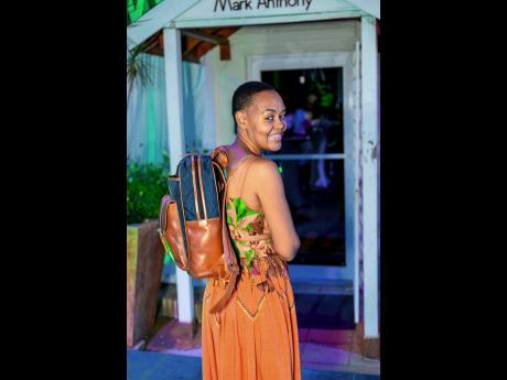 Deidre Mullings could not wait to get her hands on one of the backpacks in Mark Anthony’s newest leather collection.