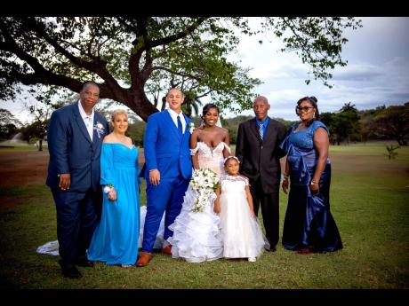 The newly-weds and their daughter, Savannah, are happy to receive love and support from Clive and Sharon Haynes (left), parents of the groom, and Evans Watson and Hyacinth Gayle-Watson, parents of the bride, on their wedding day.