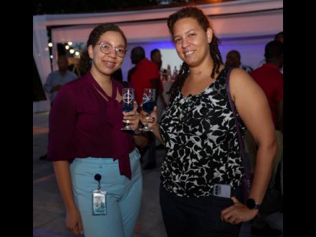 Kristina Codner (left), senior compliance officer and Ashley Codner, sustainable development specialist, Planning Institute of Jamaica, posed for the camera at the launch of the Nissan X-Trail e-POWER.