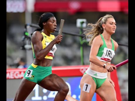 Tovea Jenkins (left) of Jamaica competing in the 4x400 metres mixed relay at the Tokyo 2020 Olympic Games.