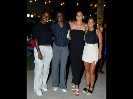  From left: Reggae Girlz Sanara Murray, Liya Brooks, Sydney Schneider, and Peyton McNamara take a group shot at a send-off held at The Summit.