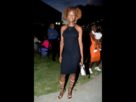 Defender Sashana Campbell served looks in a black halter and strappy sandals.