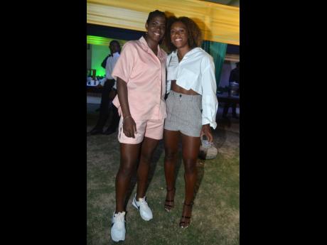 Kadesha ‘Bunny’ Shaw (left), donning a cool summer set, poses with teammate Allyson Swaby. 