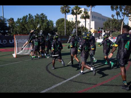 Jamaica’s Lacrosse team celebrates beating Italy at the World LaCrosse Championships yesterday in San Diego, California.