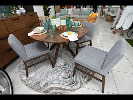 Grey is the new neutral shade and you can elevate your space with a statement rug or trays with matching glass sets.