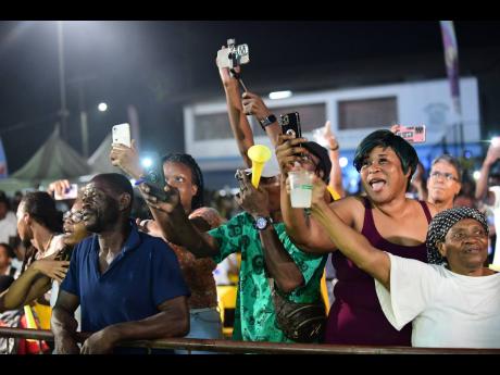 Patrons react to ‘Sizzla’ as he performs at the Wray and Nephew Fight Nights held at Cling Cling Oval in St Andrew, on Saturday. 