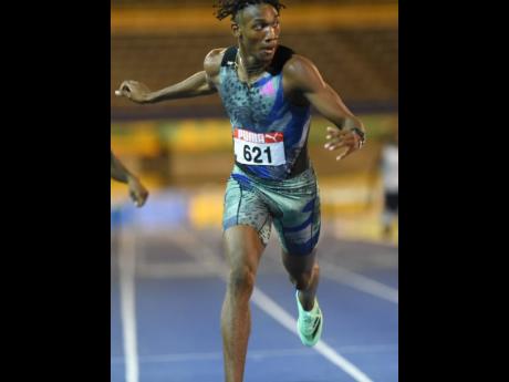 Roshawn Clarke wins the national men's 400 metres hurdles title in 47.85 seconds at the National Stadium last night. Clarke's time equalled the World Under-20  Record. 