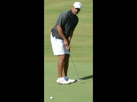 Petrojam GM Winston Watson play in the Duke of Edinburgh Golf Tournament at the Caymanas Golf Club on March 2, 2014.