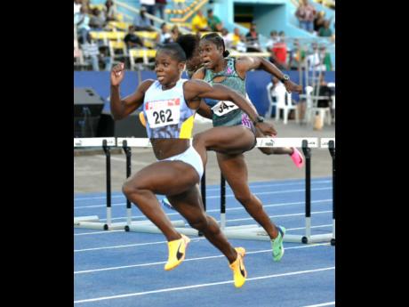 Megan Tapper strides towards hurdles during her storm towards her third 100-metre hurdles national title at the JAAA/PUMA National Senior and Junior Championships inside the National Stadium earlier this evening.