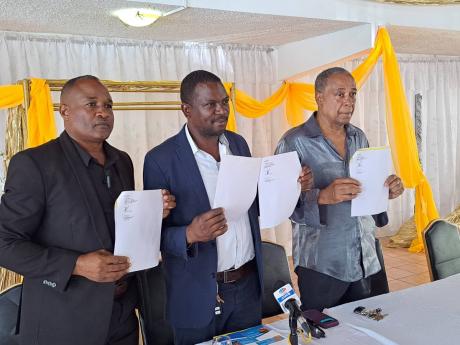 The three councillors from Western Westmoreland, show their official letters of resignation. From left: Ian Myles, Little London division; Garfield James, Sheffield division; and Lawton McKenzie, Grange Hill division.