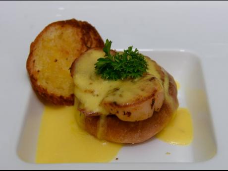 Scallops Benedict with jerked pork and pimento hollandaise.