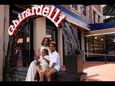 Kelly Rowland and her sons at The Original Ghirardelli Chocolate & Ice Cream Shop at Ghirardelli Square in San Francisco on Tuesday.