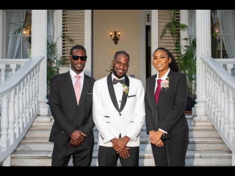 All decked out in black, the groom’s party included groomsman Zedaire Forbes (left) and best woman, Diandra Snow.