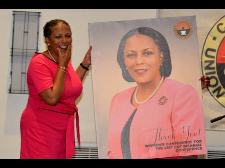 Nadine Molloy, keynote speaker and executive board member of Education International, became emotional after receiving a portrait of herself ahead of the 41st Caribbean Union of Teachers Women’s Biennial Conference at The Jamaica Pegasus hotel in New Kin