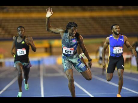 Rpshawn Clarke (centre) wins the men's 400-metre hurdles ahead of Jaheel Hyde (right) and Assinie Wilson during the JAAA/PUMA Senior and Junior Championships at the National Stadium recently.