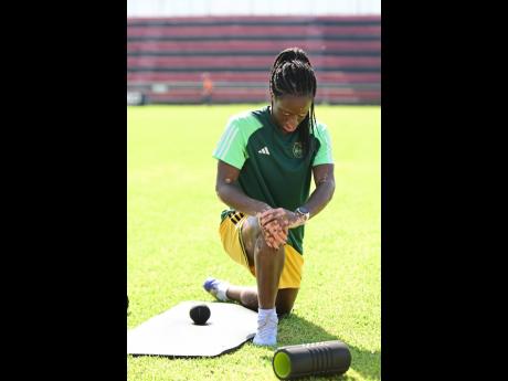 Tiffany Cameron stretches ahead of a Reggae Girlz Training Session at Anthony Spaulding Sports Complex in Kingston on Wednesday, June 14.
