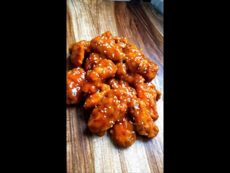 Here is a closer look at the signature wings smothered in Tennyson’s home-made mango rum sauce.